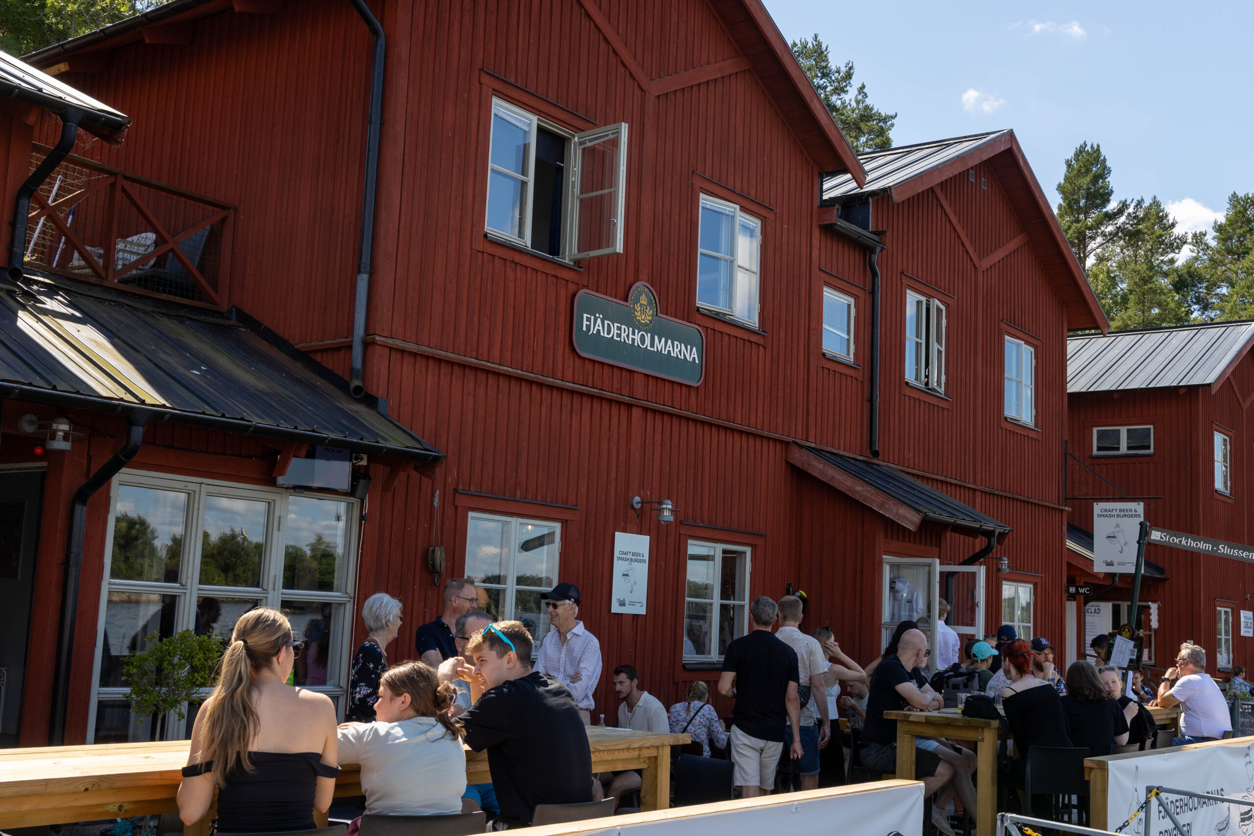 Fjäderholmarna Photo of red houses at harbour at Fjäderholmarna Islands.