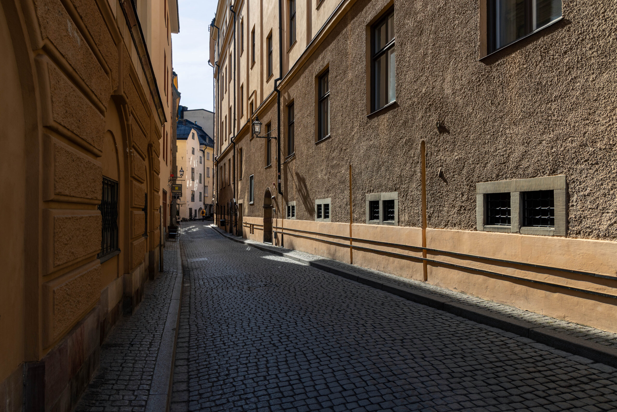 Cobble stone alley (street: Österlånggatan) in Gamla Stan district, in Stockholm Sweden.