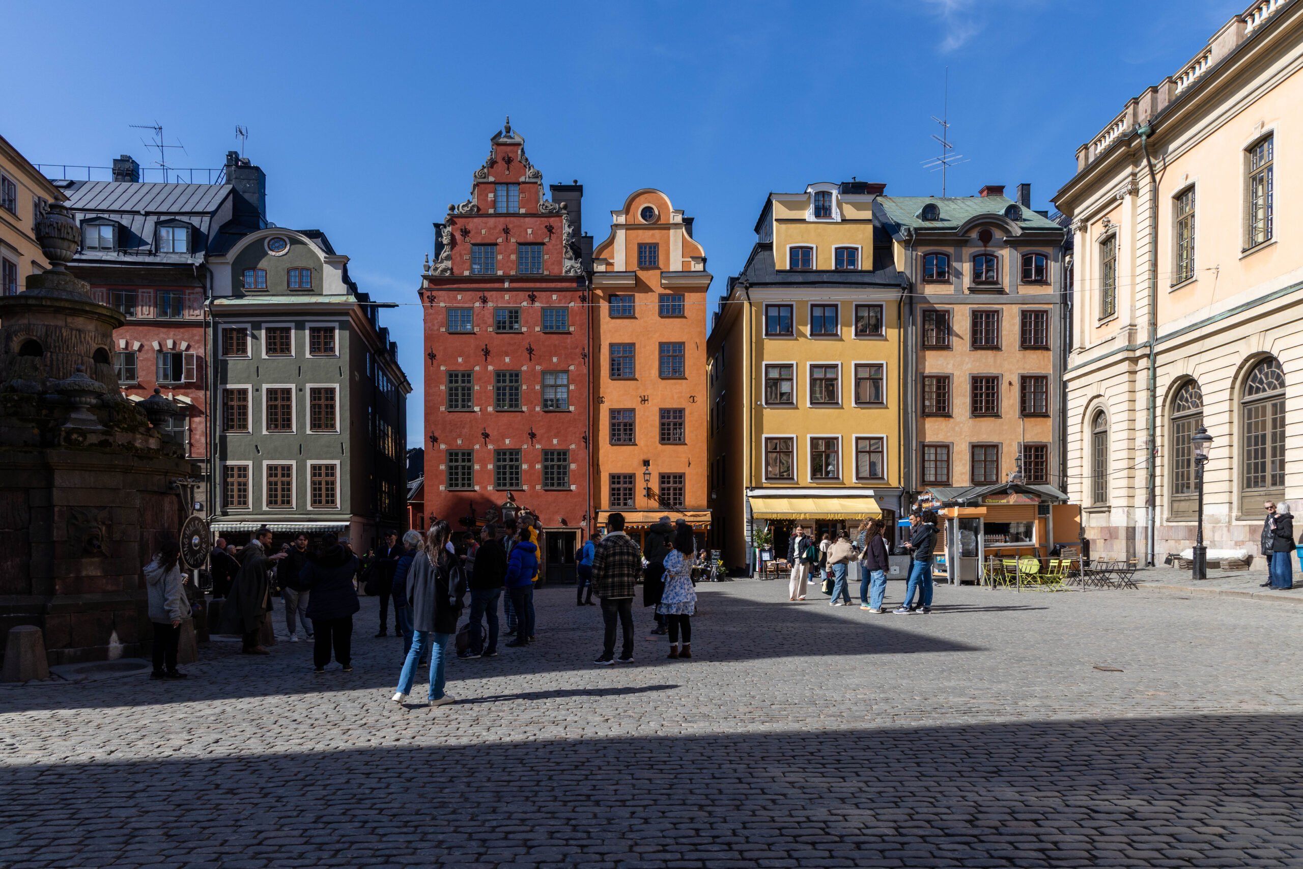 Photo of Stortorget Square with its quintessential colorful buildings, in Stockholm, Sweden.