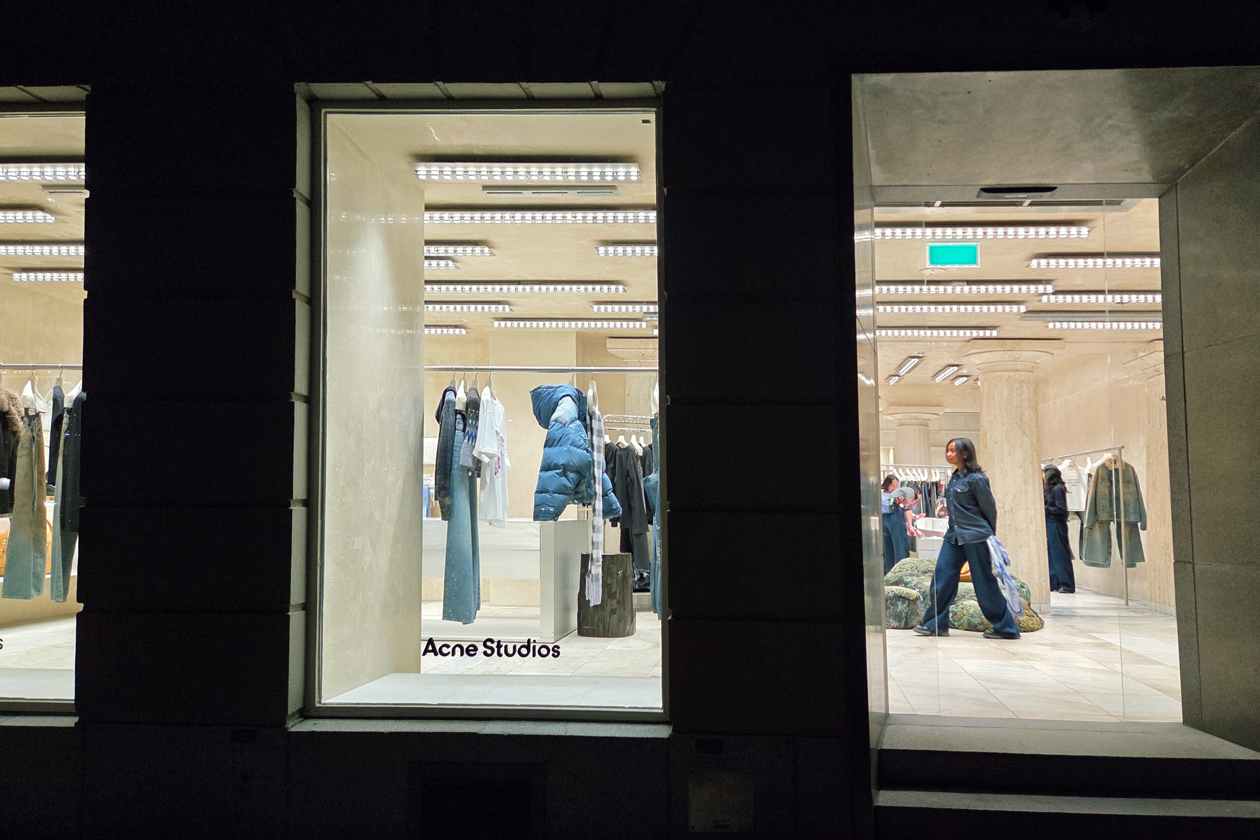 Acne Studios flagship store front at night on Norrmalmstorg